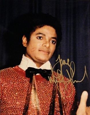 Michael Jackson signed promo photo. Promotional photo autographed as: Love Michael Jackson. 8x 