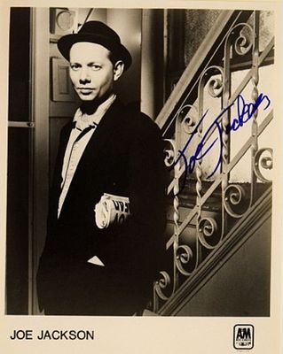 Joe Jackson signed promo photo. 8 in. by 10 in. Black and white promotional photo autographed by 