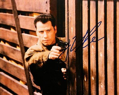 Face Off John Travolta signed movie photo. 8 in. by 10 in. Movie photo autographed by John Travolta.