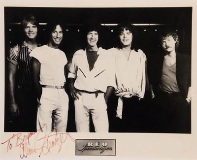 REO Speedwagon signed promo photo. 8 in. by 10 in. REO Speedwagon Black and white promotional 