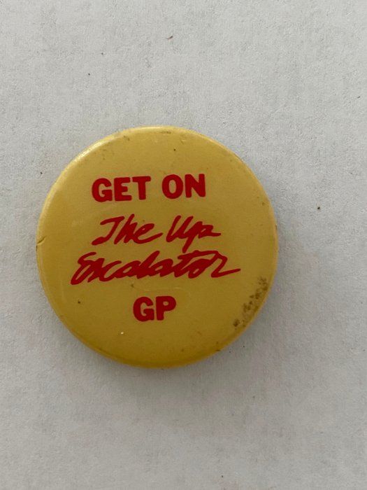 Lot 624: Get on the Up Escalator GP vintage pin
