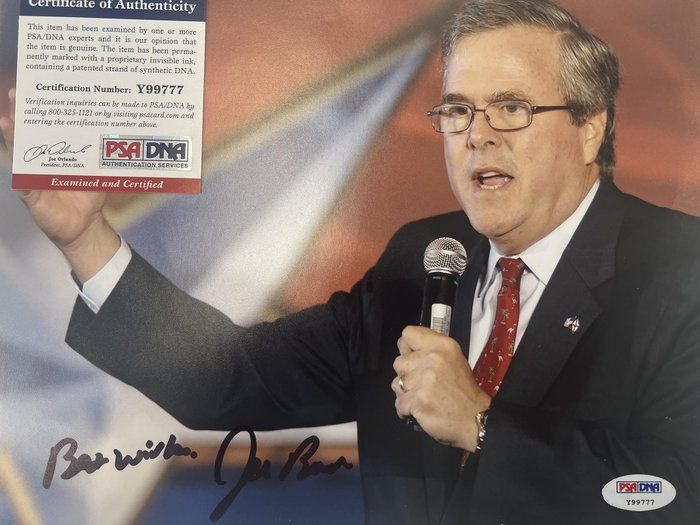 Lot 673: Jeb Bush signed photo. PSA