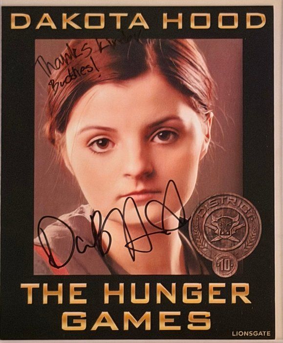 Lot 674: The Hunger Games Dakota Hood signed movie photo