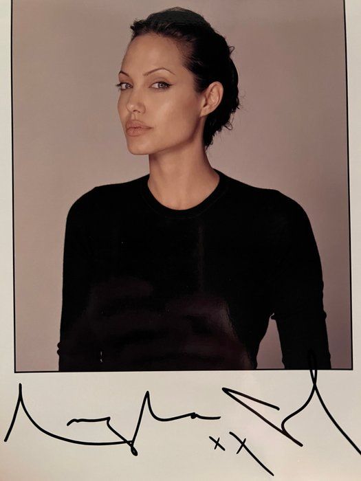 Lot 261: Angelina Jolie facsimile signed photo. 8x10 Inches