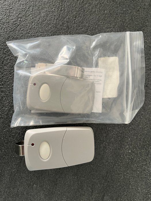 Lot 592: The Garage Stop Universal Garage Door Opener Remote Two-Pack