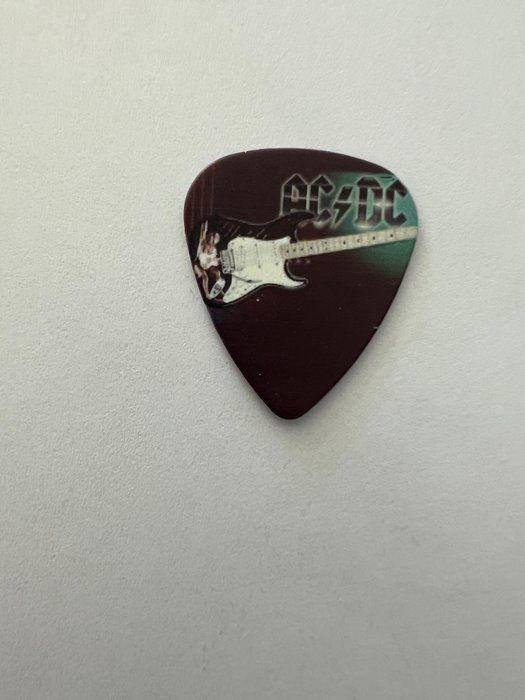 Lot 623: AC/DC guitar pick