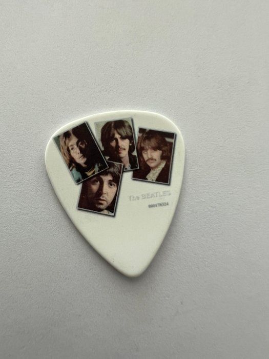 Lot 663: The Beatles guitar pick