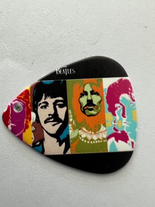 Lot 726: The Beatles guitar pick