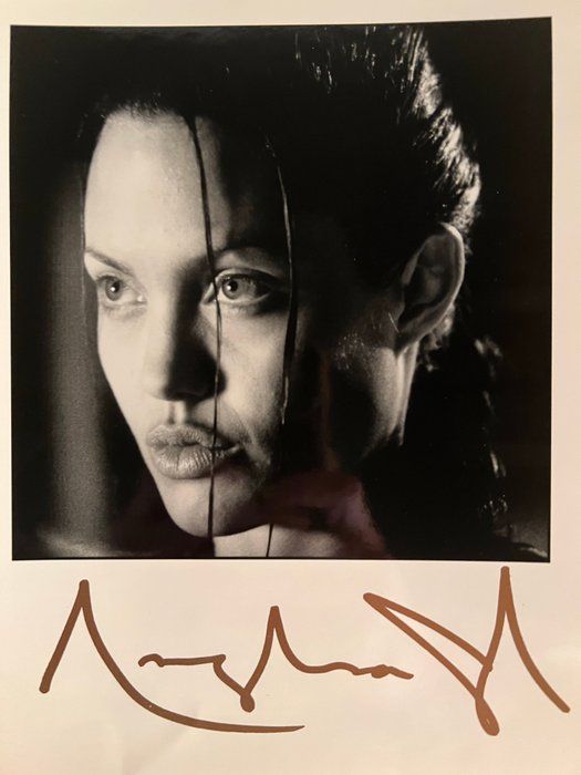 Lot 812: Angelina Jolie facsimile signed photo. 8x10 Inches