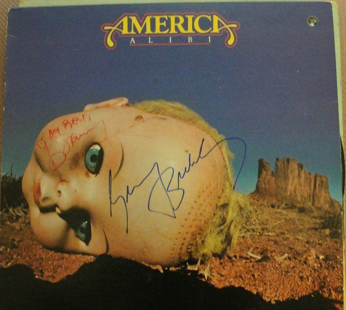 Lot 261: America Alibi band signed album