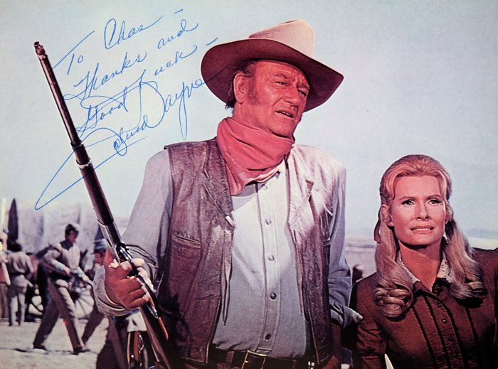 Lot 269: John Wayne signed movie photo