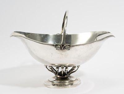 Antique Sterling Silver Candy/Nut Basket. DESCRIPTION: Floral details at the base and handle 