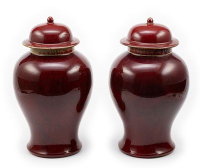 Pair of Chinese Sang de Boeuf Jars. DESCRIPTION: Qing Dynasty ox blood glazed lidded vase or