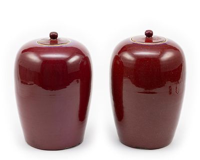 Pair of Chinese Sang de Boeuf Jars. DESCRIPTION: Qing Dynasty ox blood glazed lidded jars. The