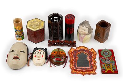 12 Asian Decorative Pieces. DESCRIPTION: Includes masks, pencil holders, and more. MEASUREMENT: