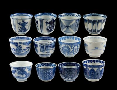 12 Asian Blue & White Porcelain Teabowls. DESCRIPTION: Designs include human figures, florals