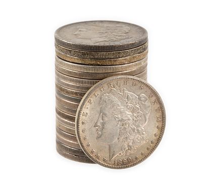 Nineteen Morgan And Peace Silver Dollars. The lot includes eighteen Morgan dollars and one Peace