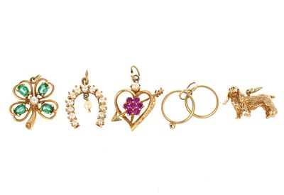 Five 14K Gold Charms. The largest of them is 7/8" length. Total weight is 12.2 grams.