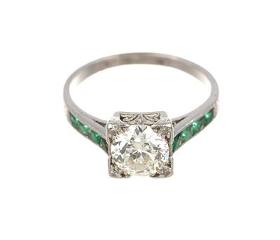 Antique Platinum 1.07 Ct Diamond and Emerald Ring. Antique platinum setting with approximately 