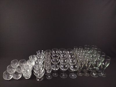 62 Pcs Unmarked Glassware. Includes 8 goblets, 10 champagne flutes, 9 large wine glasses, 4 