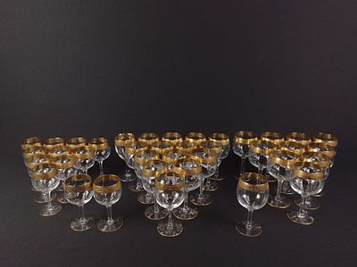 38 Gold-Colored Rimmed Wine Glasses. 38 glassware wine glasses of various sizes with golden 
