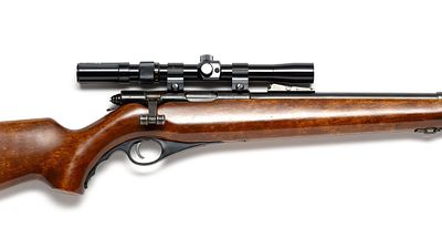 Mossberg Model 146B .22 LR Rifle. A Mossberg tube-fed bolt action .22 LR equipped with a Tasco 