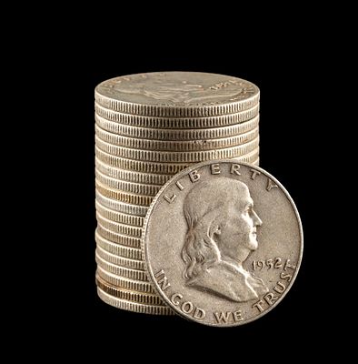 Twenty Franklin and Kennedy Silver Half Dollars. Two are Kennedy half dollars which are from 