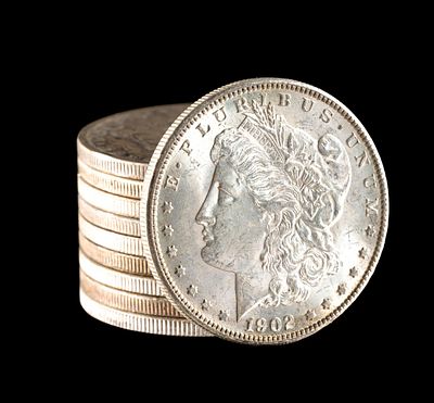 Ten Morgan Silver Dollars. Most are AU to uncirculated with one worn coin being 1896-O.