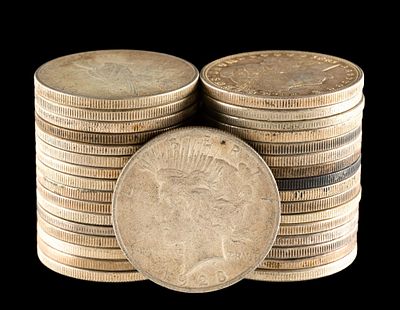 Thirty Three Morgan and Peace Silver Dollars. A mixture of common date silver dollars with 