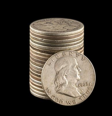 Twenty Silver Half Dollars. Walking Liberty and Franklin halves, with one being a 1964 Kennedy.