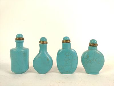 4 Turquoise Stuff Bottles. All still have spoons. 1-1/2" to 1-3/4" wide X 2-3/4" to 3" high.