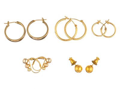 Five Pairs of 14K Gold Earrings. Four pairs of hoops and one pair of bead studs. The largest 