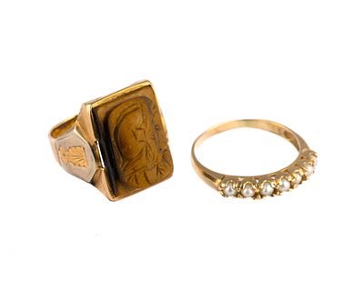 Two 10K Gold Rings. One a size 6.5 tiger eye Roman soldier cameo. The gold is yellow with white 