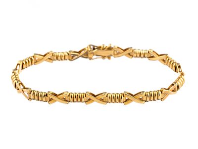 Aurafin 14K Gold Bracelet. A 7" length bracelet with hinged designer links. The weight is 11.7 grams.