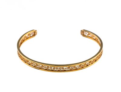14K Gold Bangle Bracelet. The bangle opening is 1 1/4" and the inner width is 2 1/8". It has a 