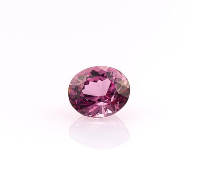 Unmounted Pink Sapphire. 1.08 carat. Natural sapphire. Translucent, oval shape. Slight 