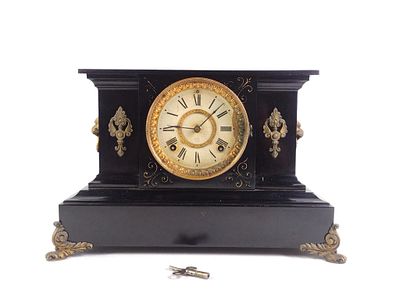 Ansonia Cast Iron Mantle Clock. Glass is separated & pendulum missing. Key comes with it. Winds up.
