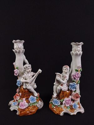 Pair of Dresden Style Figural Porcelain Candlesticks. No markings on bottom. Overall excellent 