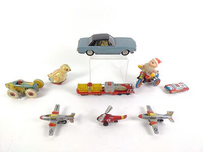 9 Children's Toys incl. Wind-Up. 2" to 3-1/4" wide x 1-1/4" to 2-3/4" high.