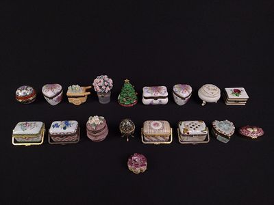 18 Trinket Boxes. Includes porcelain, floral, and Christmas. 2" to 2-1/4" wide x 2" to 2-3/4" high.