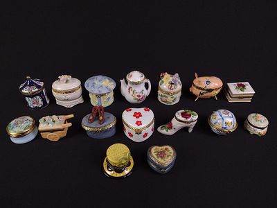 16 Porcelain Trinket Boxes. Includes floral, accessories, and pig. 1-1/2" to 3" wide x 1" to 3" high.