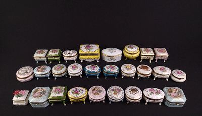 27 Porcelain Trinket Boxes incl Limoges. Mostly floral. 3-1/4" to 5" wide x 1-1/2" to 2-1/2" high.