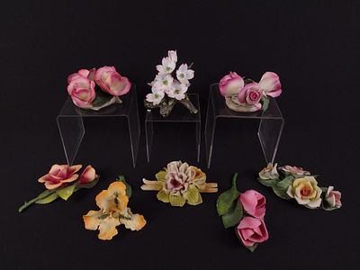 8 Italian Porcelain Flower Figurines. 5" to 6-1/2" wide x 2-3/4" to 5" high.