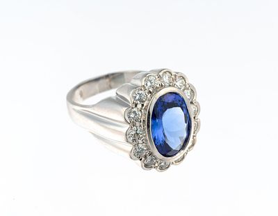 14K Gold 1.4 CTW Diamond and Tanzanite Ring. A size 7 ring in white gold with a 5.3 carat 