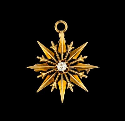 14K Gold and Diamond Pendant. A 1" width pendant or brooch with a 0.15 carat diamond in the 