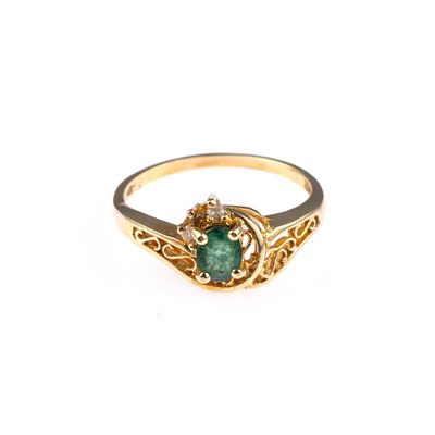 14K Gold Diamond and Tourmaline Ring. A size seven ring with an oval tourmaline and small 