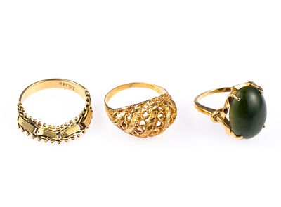 Three 14K Gold Rings. A size 5.5 ring with jade gemstone, a filigree ring size 7, and a flexible 