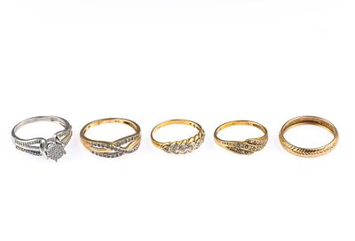 Five 10K Gold Rings. Five rings in yellow and white gold with sizes ranging from 7 to 9. Total 