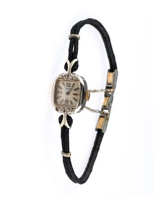 14K Gold Waltham Cord Watch. A white gold cased cord watch 14 mm width. The watch runs but has 