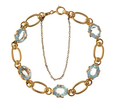 14K Gold and Aquamarine Bracelet. A 7" length bracelet with five oval faceted aquamarine 